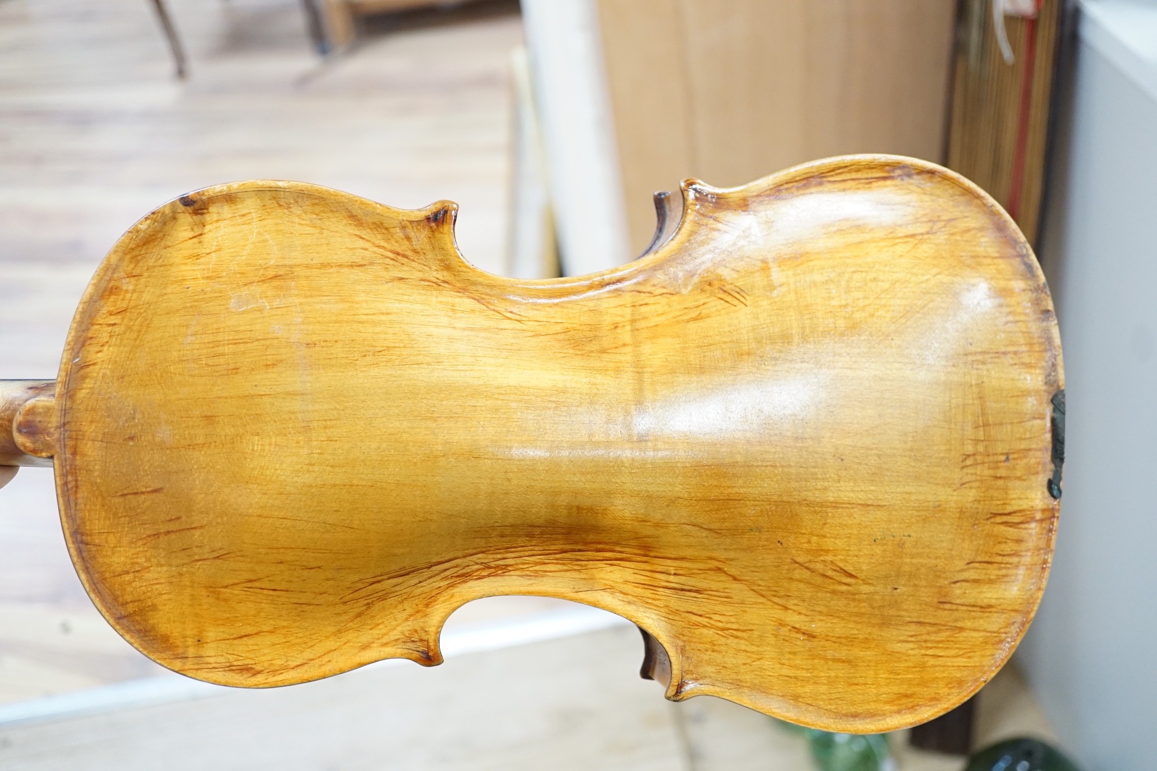 A cased violin. Label inside reads Copie de Pietro Antonius Dallas Costa fec in Treviso anno 17
